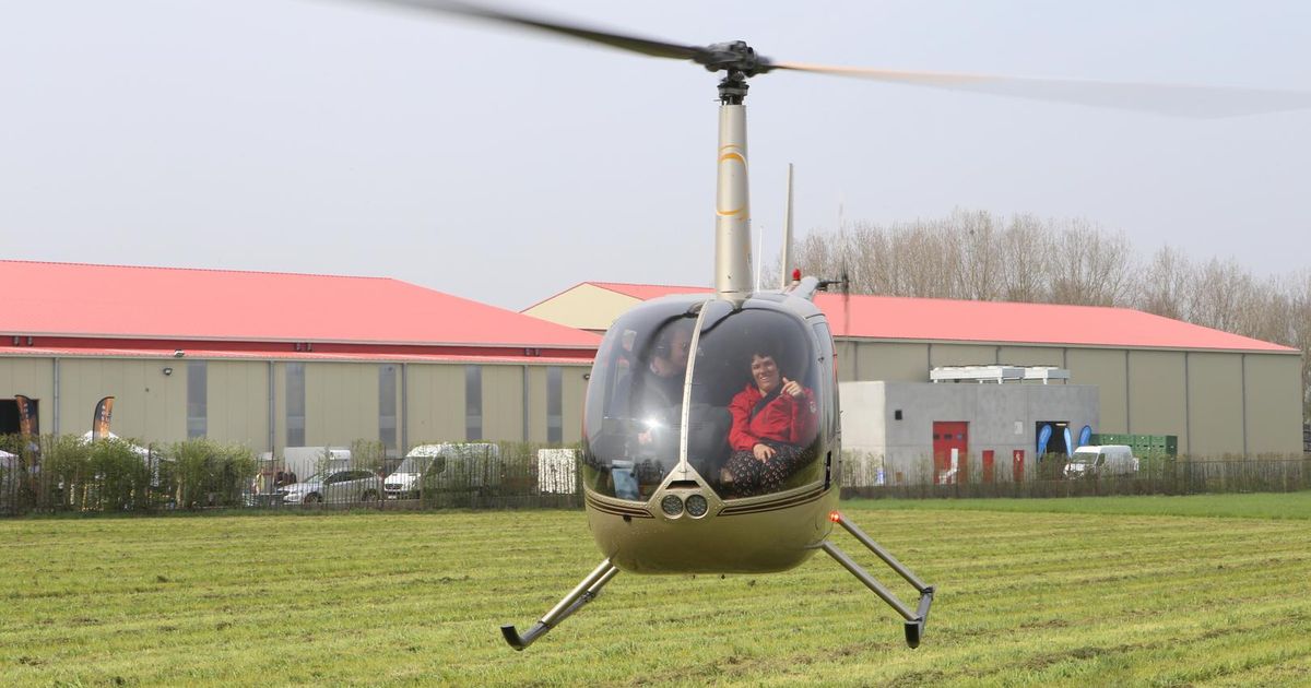 Helikopter vliegt boven fruitbloesems Zoutleeuw Regio HLN